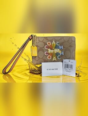 Coach Corner Zip Wristlet In Signature Canvas With Coach Radial Rainbow C7308